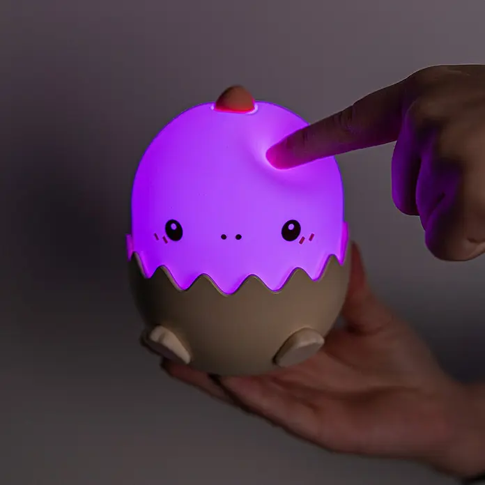 Lámpara de sobremesa Dino - 0,75 W, L x An x Al: 10,9 x 9,3 x 12,5 cm, Beige - Adorable luz de noche en forma de huevo con luz morada, tocada por una mano, perfecta para una iluminación nocturna suave.