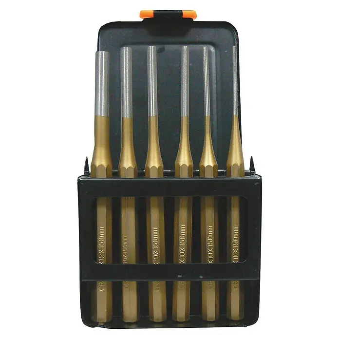 Punzón botador - 6 pzs. - Un juego de punzones de pasador y de centro en varios tamaños, cuidadosamente guardados en una caja de herramientas negra.