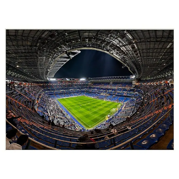 Papermoon Poster - Santiago Bernabèu, B x H: 50 x 40 cm, Mit Passepartout - Innenansicht des Stadions Santiago Bernabéu mit Fußballfeld und blau-orangen Sitzen, die sich unter dem geschwungenen Dach des Veranstaltungsortes erstrecken.