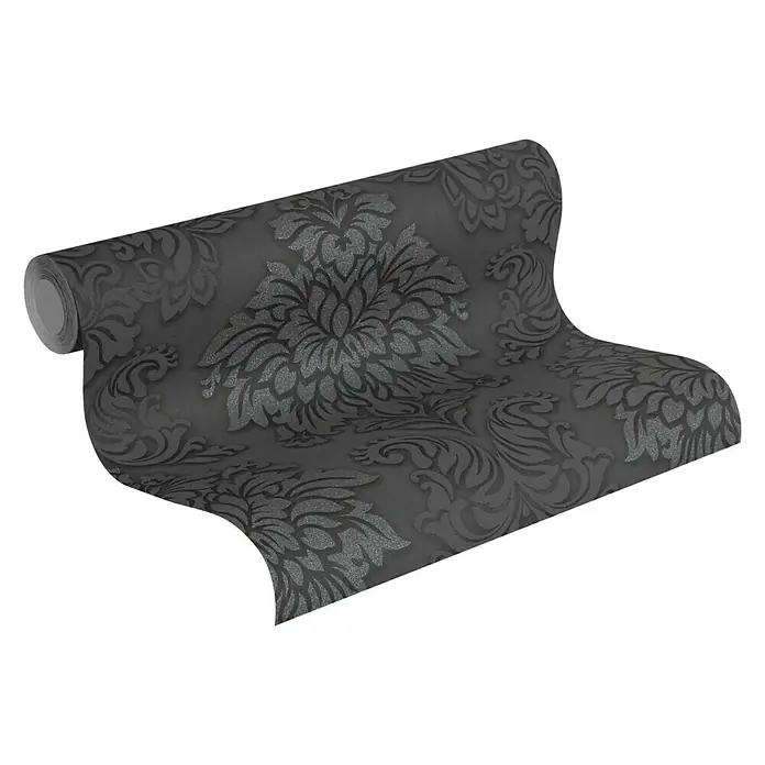 A.S. Création Metropolitan Stories Vliestapete Damask - Grau/Schwarz, Ornament, 10,05 x 0,53 m - Eine Rolle dunkler floral gemusterter Tapete, teilweise abgerollt, wobei das komplizierte Muster hervorgehoben wird.