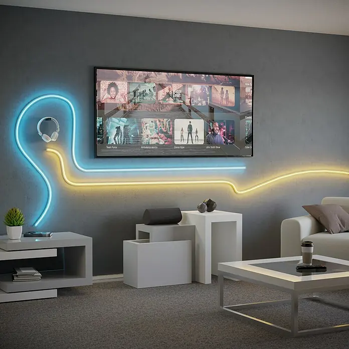 Eglo Connect LED-Stripes Neon-Stripe-Z - 5 cm, Lichtstrom: 3.400 lm, RGBW - Eine stilvolle Neonkunstinstallation mit Kopfhörern, die an einer grauen Wand neben einem Fernseher mit Filmen hängt.