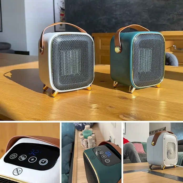 Keramik-Heizlüfter Retro Heater - 1.000 W, Grün - Eine Nahaufnahme von zwei tragbaren, quadratischen Heizlüftern mit Griff und goldenen Füßen auf einem Holztisch.