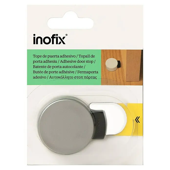 Inofix Tope de puerta 2420 - Plástico, Cromo - Primer plano de un paquete de topes adhesivos Inofix®, que muestra una base metálica redonda con un acento de goma blanca y negra.