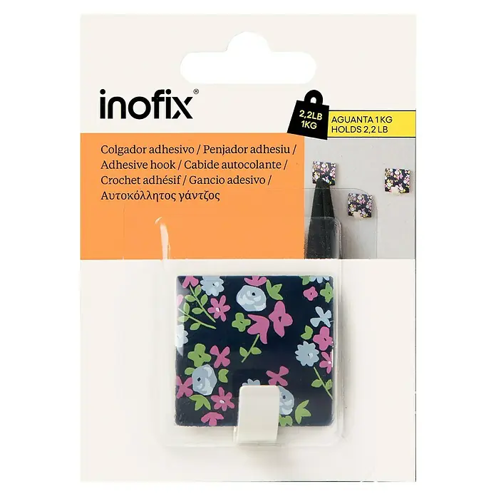 Inofix Colgador adhesivo Floral - L x An x Al: 4 x 4,2 x 2,5 cm, Azul - La imagen muestra un gancho adhesivo Inofix con un estampado floral, soporta hasta 1 kg, con descripciones en varios idiomas.