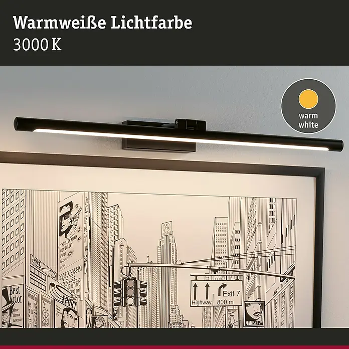 Paulmann LED-Bilderleuchte Mingo - 14 W, L x B x H: 17,5 x 61,5 x 5 cm, Schwarz, Warmweiß - Schwarze Bilderleuchte mit warmweißem Licht (3000 K) beleuchtet ein gerahmtes Comic-Bild.
