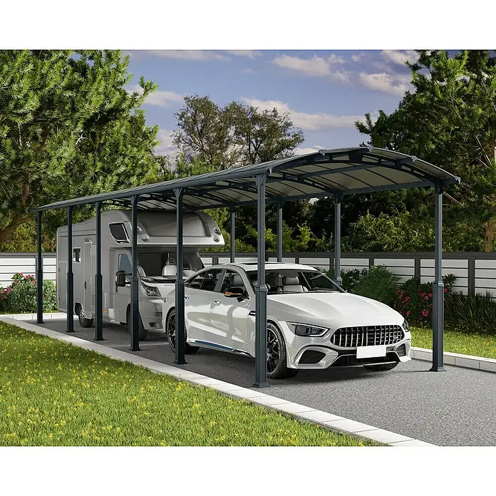 Palram – Canopia Carport Alpine - Medidas ext. (An x Pr): 3,59 x 12,9 m, Carport individual, Antracita - Imagen de una cochera moderna con un coche y una autocaravana debajo, rodeada de vegetación.