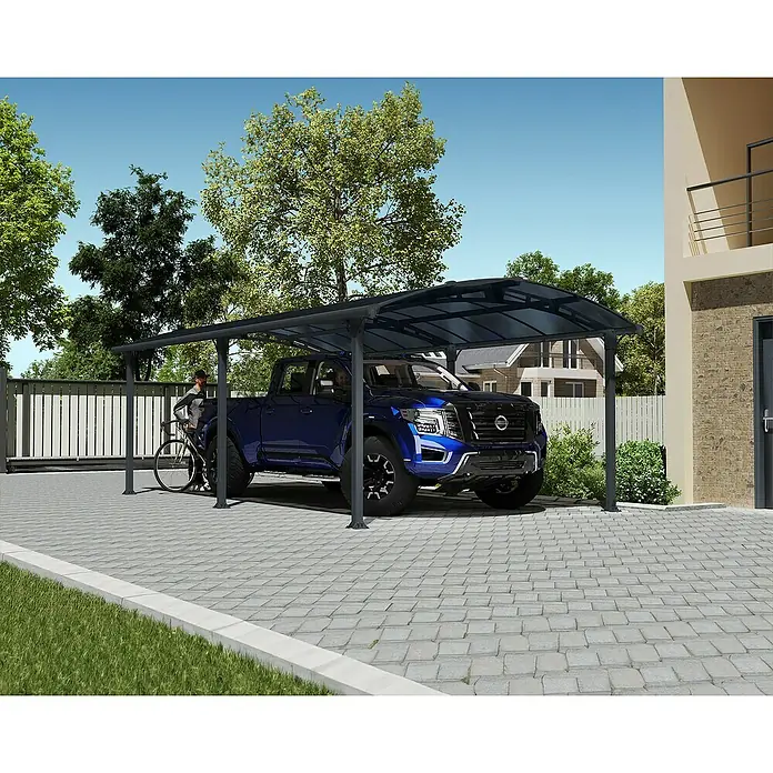 Palram – Canopia Carport Arcadia 6400 - Außenmaß inkl. Dachüberstand (B x T): 3,59 x 6,49 m, Doppelcarport, Grau - Ein geräumiger Carport mit einem dunkelblauen Truck darunter, der Schutz vor den Elementen bietet und gleichzeitig stilvoll aussieht.