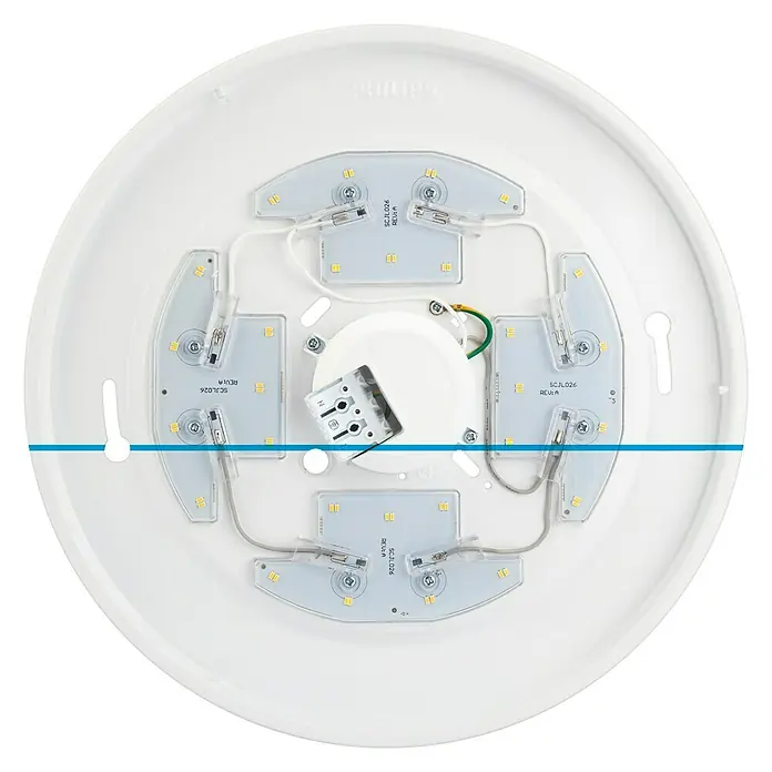Philips Plafón LED redondo Moire Gen II - 6 W, Ø x Al: 225 mm x 6,8 cm, Blanco, Blanco neutro - Un primer plano de una lámpara de techo LED redonda Philips, que muestra los componentes internos y la electrónica.