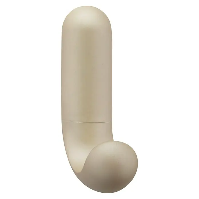 Inofix Colgador adhesivo 2088-B - Beige, Capacidad de carga: 2 kg - Primer plano de un dispositivo de masaje beige con un diseño redondeado, que promete relajación y bienestar.
