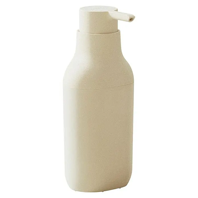 Cosmic Dosificador de jabón Alife - Blanco perla - Primer plano de una botella dispensadora de jabón beige y minimalista con bomba, que muestra un elegante accesorio de baño.