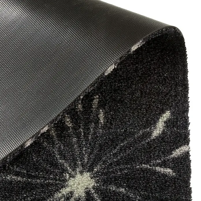 SCHÖNER WOHNEN-Kollektion Fußmatte Pusteblume - Anthrazit/Mint, 100 x 67 cm - Nahaufnahme einer schwarzen Fußmatte mit abstraktem Blumenmuster und rutschfester Rückseite, ideal für den Innenbereich.