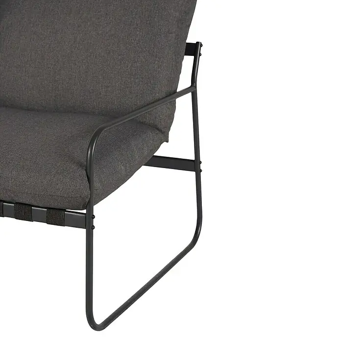 Conjunto de muebles Theodor - 4 pzs., Acero/Poliéster, Antracita - Primer plano de un sillón con tapicería de tela gris y estructura de metal negro sobre un fondo a rayas.