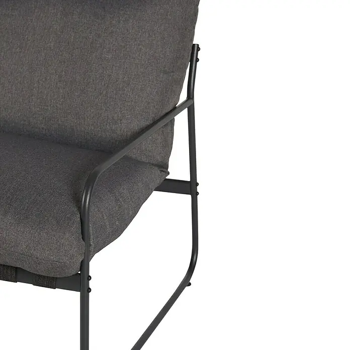 Conjunto de muebles Theodor - 4 pzs., Acero/Poliéster, Antracita - Primer plano de un sillón gris con estructura metálica, combinando diseño moderno y confort.\n