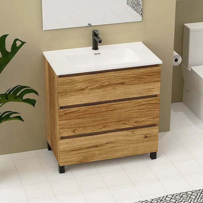 Artysan Conjunto de mueble de baño Neeko - Ancho: 80 cm, Teka, 3 pzs. - Imagen de un lavabo con tres cajones aspecto madera y un lavabo sobre encimera blanco delante de una pared beige.
