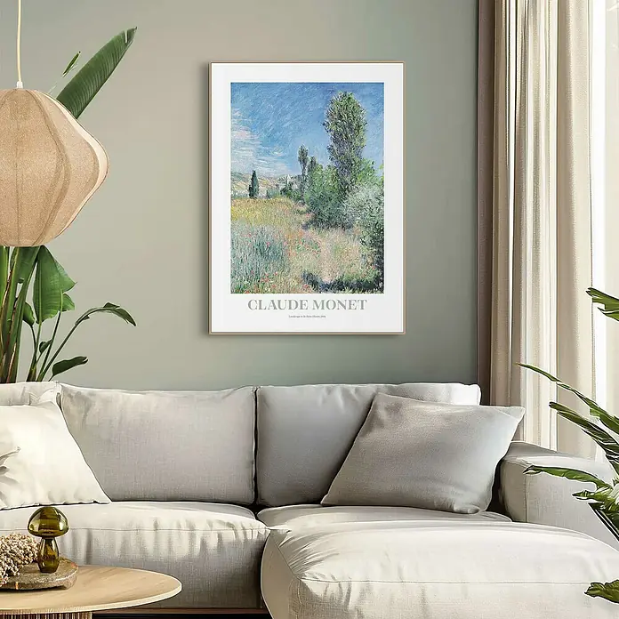 Reinders Bild Slim Frame - Monet Landscape, B x H: 50 x 70 cm - Ein gerahmtes Claude Monet Poster hängt über einem grauen Sofa in einem gemütlichen Wohnzimmer und verleiht dem Raum eine künstlerische Note.
