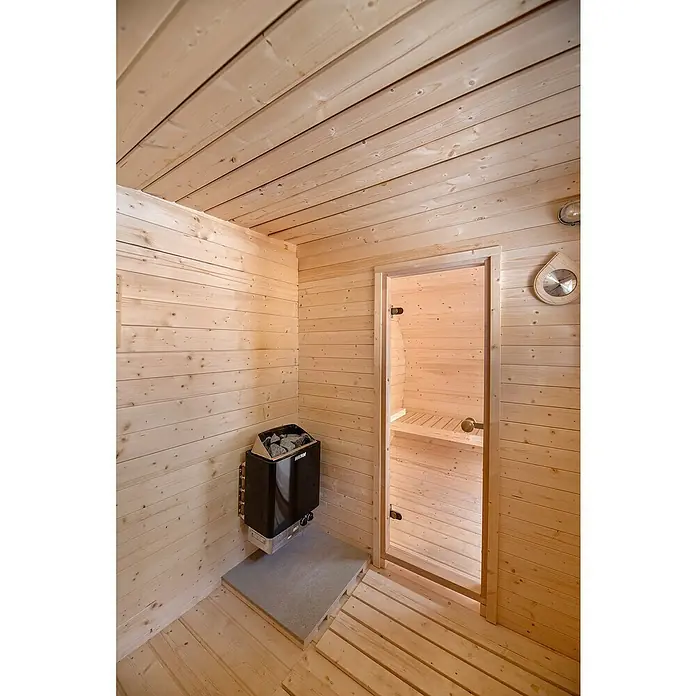 Tuindeco Saunahaus - L x B x H: 405 x 240 x 216 cm, Ohne Ofen - Innenansicht einer Sauna mit einem Harvia Saunaofen, Holzwänden und Bänken, die ein entspannendes Wellness-Erlebnis versprechen.