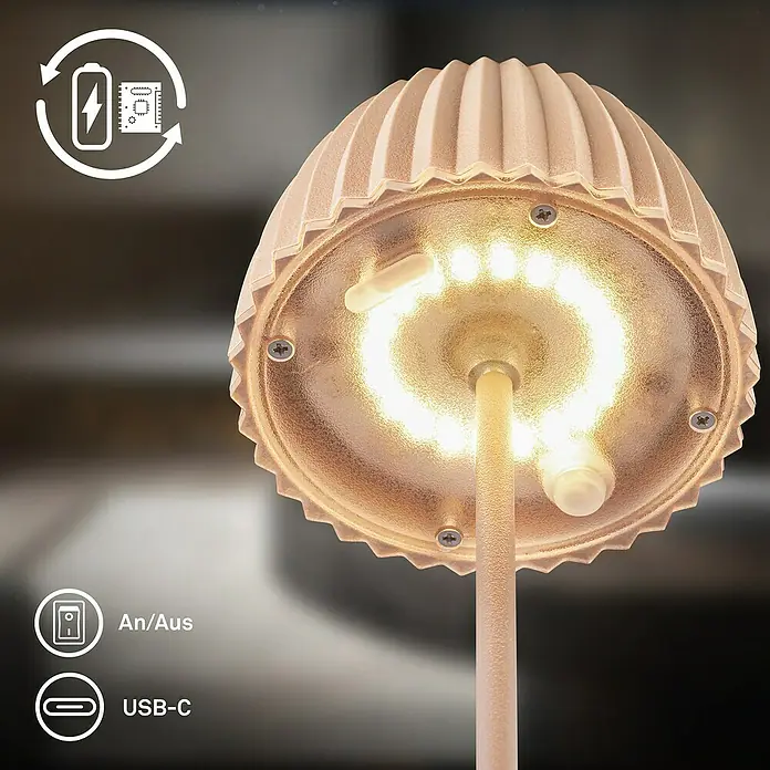 Brilo Riffle Akku-Tischleuchte - Ø x H: 8,5 x 20,1 cm, Beige, Warmweiß, 1,5 W, IP44, Mini - Nahaufnahme einer stilvollen Tischleuchte mit LED-Beleuchtung und den Symbolen für Akku/USB-C-Aufladung und An/Aus-Schalter.