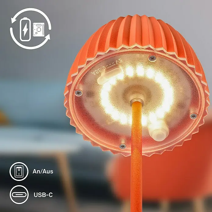 Brilo Riffle Akku-Tischleuchte - Ø x H: 8,5 x 20,1 cm, Orange, Warmweiß, 1,5 W, IP44, Mini - Nahaufnahme einer orangefarbenen LED-Tischleuchte mit wiederaufladbarem Akku und USB-C-Anschluss für stimmungsvolle Beleuchtung.