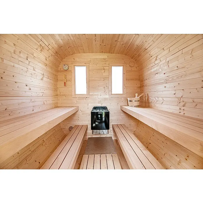 Tuindeco Saunaofen Harvia Trendy XE - 9 kW, Raumheizvermögen: 7 m³ - 13 m³ - Innenaufnahme einer Sauna mit Holzbänken und einem Harvia Saunaofen, der für Wärme und Entspannung sorgt. Die hellen Holzvertäfelungen schaffen eine angenehme Atmosphäre.