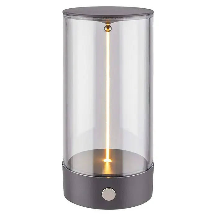 Brilo Akku-Tischleuchte Wiggle - Ø x H: 7 x 14,5 cm, Anthrazit, Warmweiß, 1,5 W, IP20 - Nahaufnahme einer modernen Tischleuchte mit einem klaren, zylindrischen Lampenschirm und einem schlanken, grauen Sockel. Die Lampe strahlt ein warmes, einladendes Licht aus.