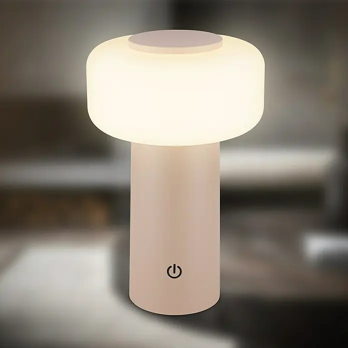 Brilo Akku-Tischleuchte Juna - Ø x H: 13 x 20,5 cm, Beige, Warmweiß, 1,8 W, IP44 - Nahaufnahme einer modernen, pilzförmigen Tischleuchte mit sanftem, warmem Licht, ideal für Nachttische oder als stimmungsvolle Beleuchtung.