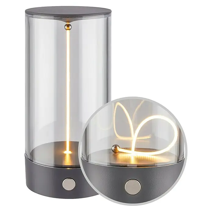 Brilo Akku-Tischleuchte Wiggle - Ø x H: 7 x 14,5 cm, Anthrazit, Warmweiß, 1,5 W, IP20 - Tischleuchte mit modernem Design. Die Lampe hat einen grauen Sockel und einen klaren Zylinder mit einer LED-Lichtquelle im Inneren.