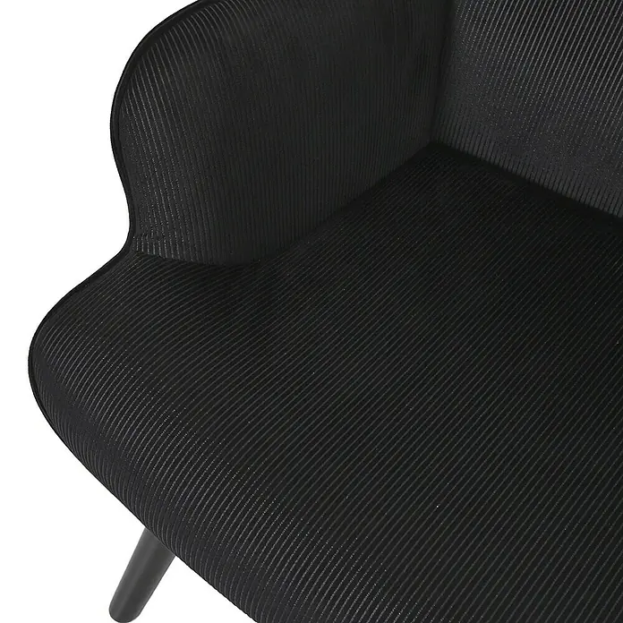 Home Deco Factory Giulia Sillón - L x An x Al: 75 x 68 x 96 cm, Negro - Primer plano de una silla negra con un tejido texturizado, que destaca su calidad artesanal y su diseño elegante.