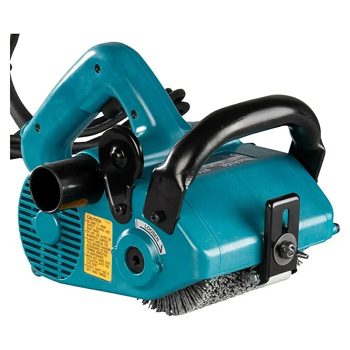 Makita Renovierungsschleifer 9741J - Leerlaufdrehzahl: 3.500 U/min, 860 W - Nahaufnahme einer Makita-Stahldrahtbürste zum Entfernen von Beschichtungen, Rost und Farbe. Leistungsstark und zuverlässig für verschiedene Anwendungen.