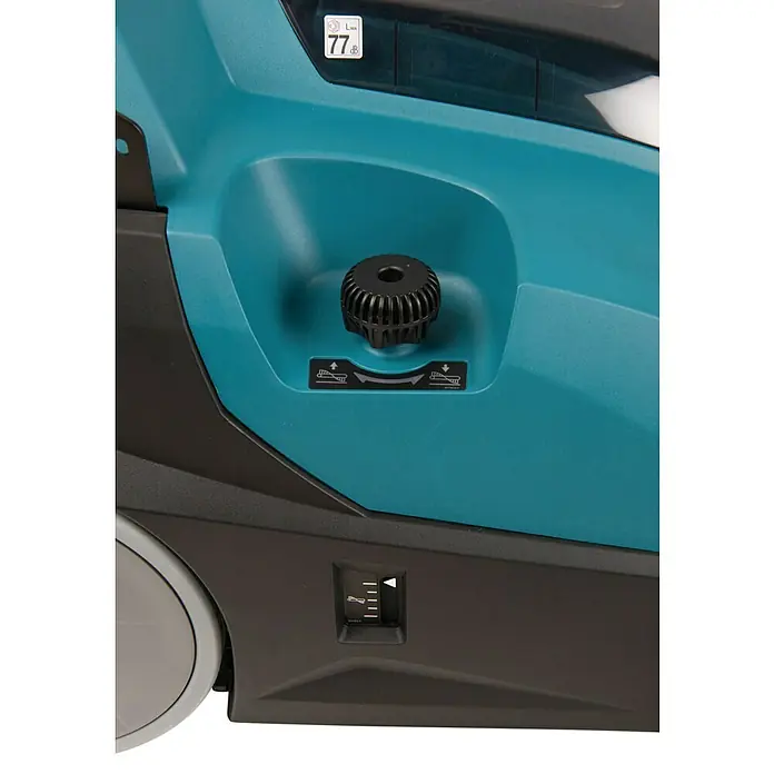 Makita XGT 40V max. Akku-Handkehrmaschine VS001GZ - 40 V, Arbeitsbreite: 650 mm, 24 l - Detailaufnahme einer Makita Kehrmaschine mit Fokus auf Einstellknopf und Füllstandsanzeige.