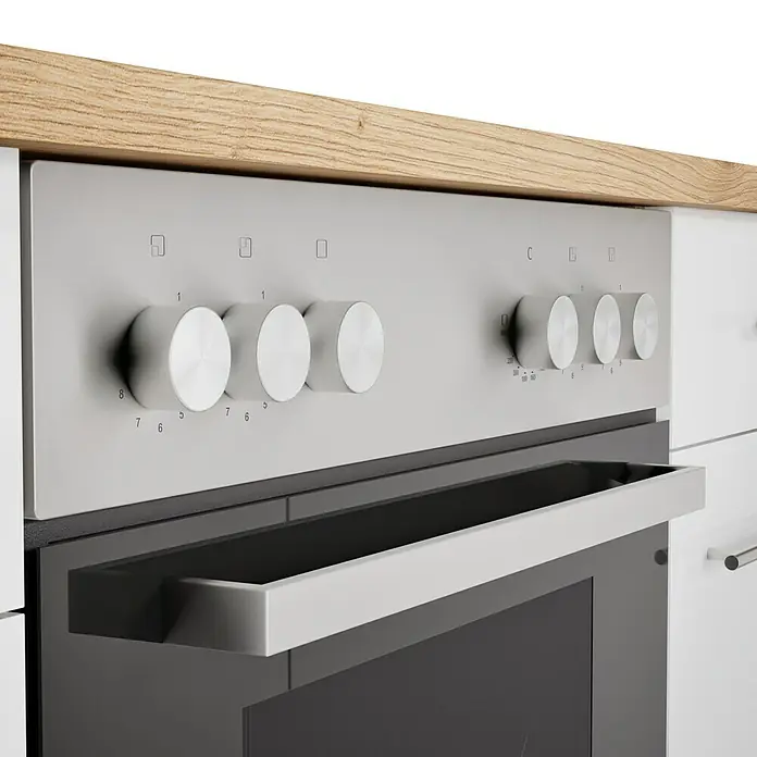 Respekta Cocina esquinera Hilde - Ancho: 220 cm, Blanco, Mate, Efecto madera, Con electrodomésticos - Primer plano de un horno empotrable moderno con mandos plateados y un inserto de cristal negro.