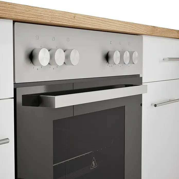 Respekta Cocina esquinera Hilde - Ancho: 310 cm, Blanco, Efecto madera, Con electrodomésticos - Horno empotrado con botones plateados y puerta de vidrio negro, integrado en una cocina moderna.