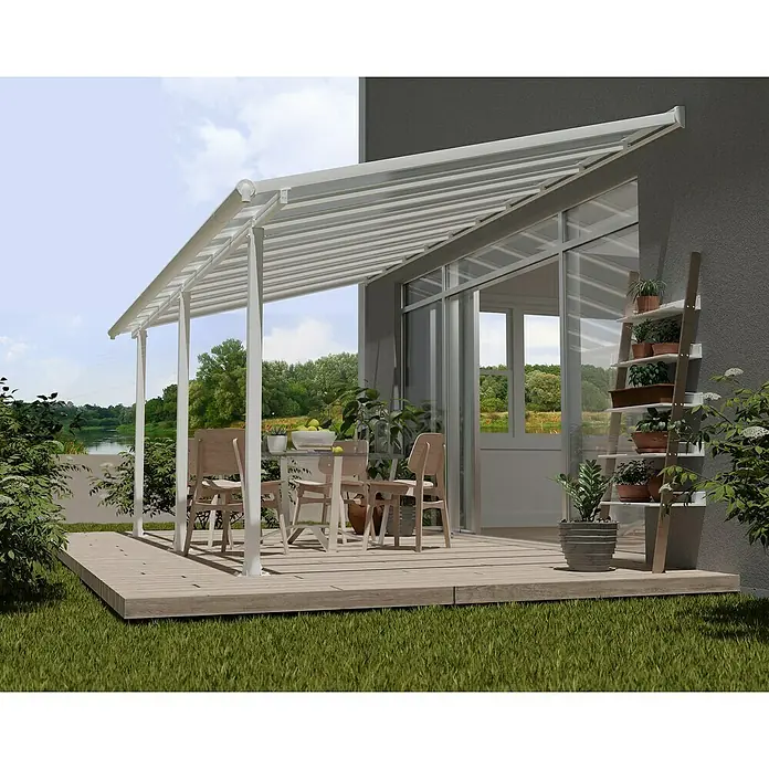 Palram – Canopia Marquesina adosada Olympia - An x Pr: 610 x 300 cm, Blanco tráfico, Policarbonato, Transparente - Imagen de una cubierta de patio con postes blancos y un techo transparente, que da sombra a un comedor exterior.