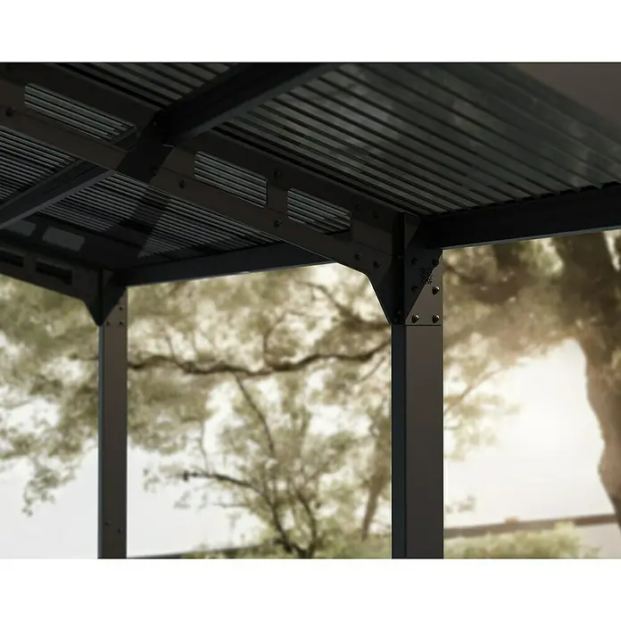 Palram – Canopia Carport Sydney Arch - Medidas ext. (An x Pr): 5,72 x 5,86 m, Negro - Vista detallada de una pérgola moderna con marco de metal gris oscuro, que ofrece estabilidad y estilo al área exterior.