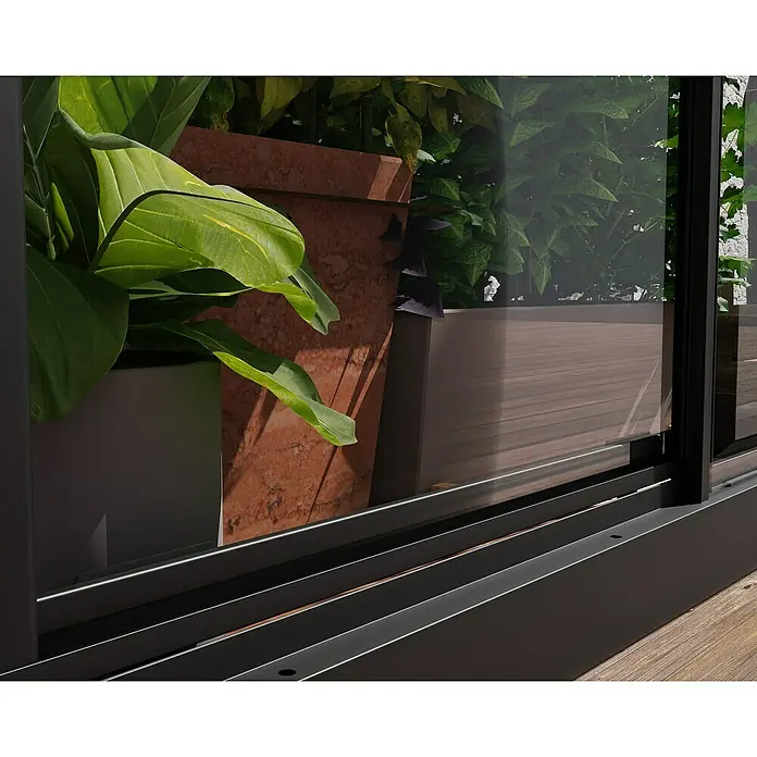 Palram – Canopia Invernadero Mini Ivy - Medidas ext. (An x Pr): 123 x 64 cm, 0,7 mm, Negro - Primer plano de una puerta corredera moderna con un marco delgado y oscuro, con vistas a plantas verdes. Diseño elegante y belleza natural.