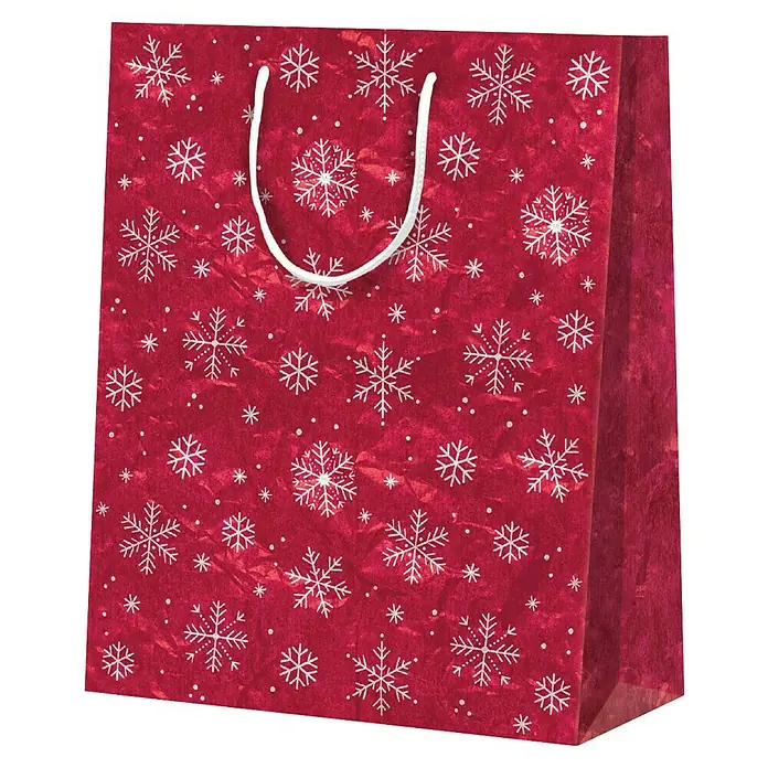Duni Geschenktüte Surprise - 9,8 x 17,8 cm, Rot - Nahaufnahme einer roten Geschenktüte mit weißen Schneeflocken und weißen Griffen für festliche Geschenkverpackungen.