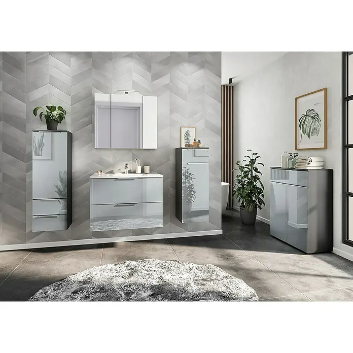 Germania Vasio Midischrank - B x T x H: 36 x 34 x 111 cm, Graphit/Silbergrau - Elegantes Badezimmer-Set in Grau mit Spiegel, Waschbeckenunterschrank und Hochschränken, ergänzt durch eine grüne Pflanze und ein gerahmtes Bild.