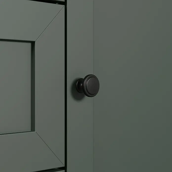 Trendteam Buffetschrank Stanton - Breite: 146 cm, Grün - Nahaufnahme eines grünen Schranks mit dunklem, rundem Knopf, der einen eleganten Akzent setzt und die moderne Gestaltung hervorhebt.