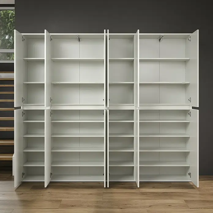 Trendteam Hochschrank Nevada - B x T x H: 222 cm x 34 cm x 191 mm, Weiß - Eine große weiße Schrankwand mit offenen Türen, die viele Regale freigibt, bietet viel Stauraum und eine clevere Aufbewahrungslösung.