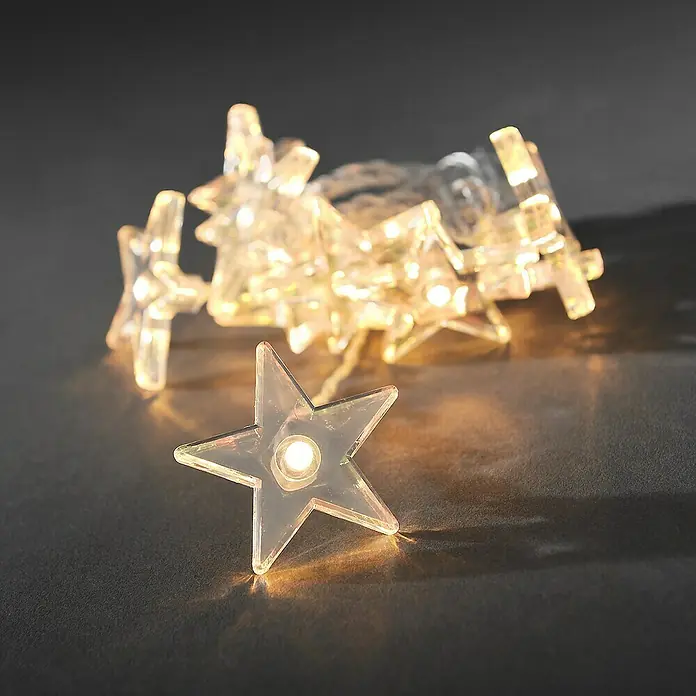 Konstsmide LED-Lichterkette Sterne - Innen, Lichtfarbe: Warmweiß, Anzahl Leuchtmittel: 10 Stk., Batteriebetrieben - Sternförmige Lichterkette mit warmweißem Licht auf dunklem Untergrund. Dekorative Beleuchtung für festliche Anlässe.
