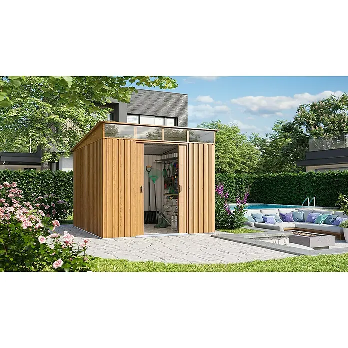 Pergart Gerätehaus Lübeck 89 - Außenmaß inkl. Dachüberstand (B x T): 238 x 278 cm, Stahl, Braun - Abbildung eines Holzschuppens mit Schiebetüren, der im Garten mit Pflanzen und einem Haus im Hintergrund steht.