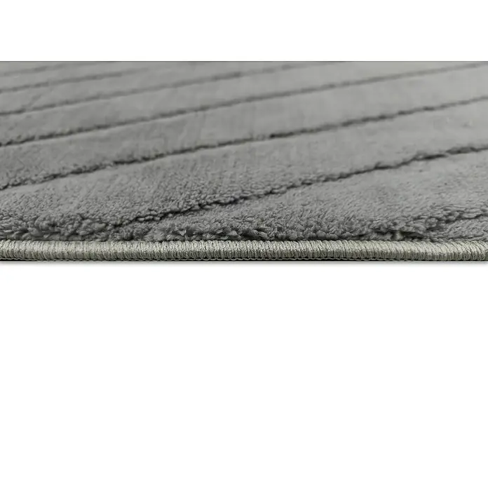 Alfombra de pelo corto Stelvio Picos - Gris, 230 x 160 cm, 100% Poliéster - Primer plano de una alfombra gris con un sutil patrón de rayas y borde limpio. Ideal para espacios modernos.