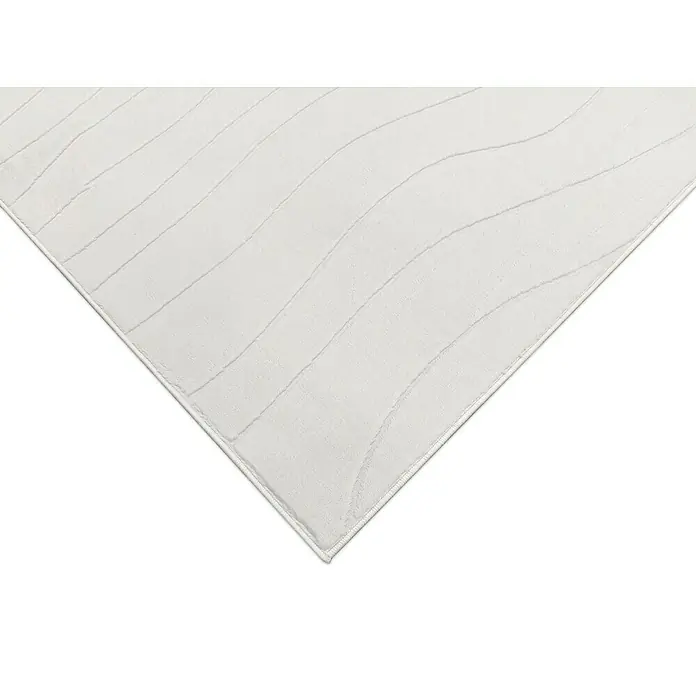Alfombra de pelo corto Stelvio Olas - Crudo, 200 x 140 cm, 100% Poliéster - Primer plano de una alfombra color crema con líneas onduladas suaves, que irradia un ambiente elegante y tranquilo.