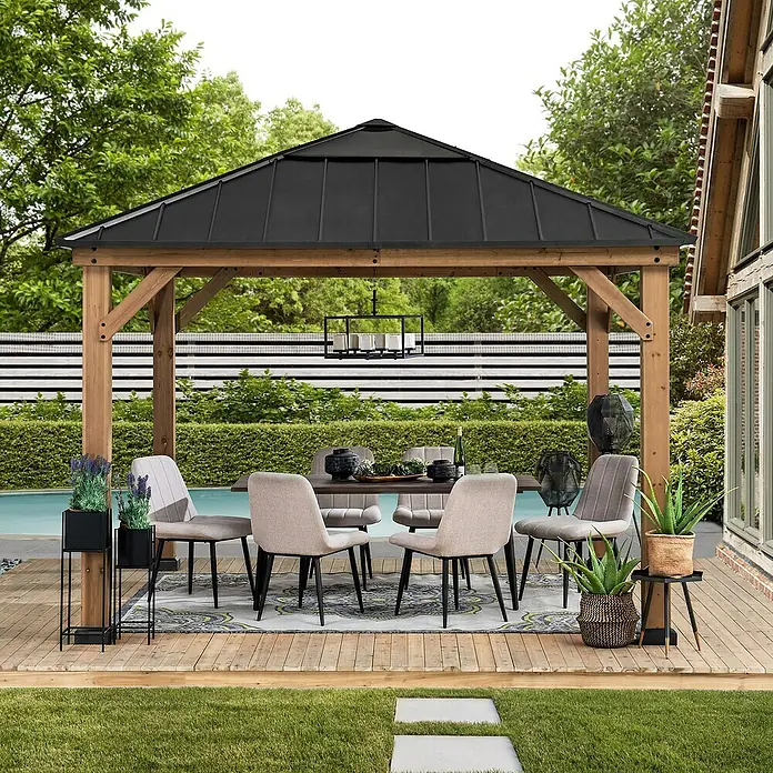 Sunjoy Pavillon Pirin - L x B: 336 x 336 cm, Farbe Dach: Anthrazit - Einladender Essbereich im Freien unter einem eleganten Pavillon mit stilvollen Stühlen und dekorativen Pflanzen.