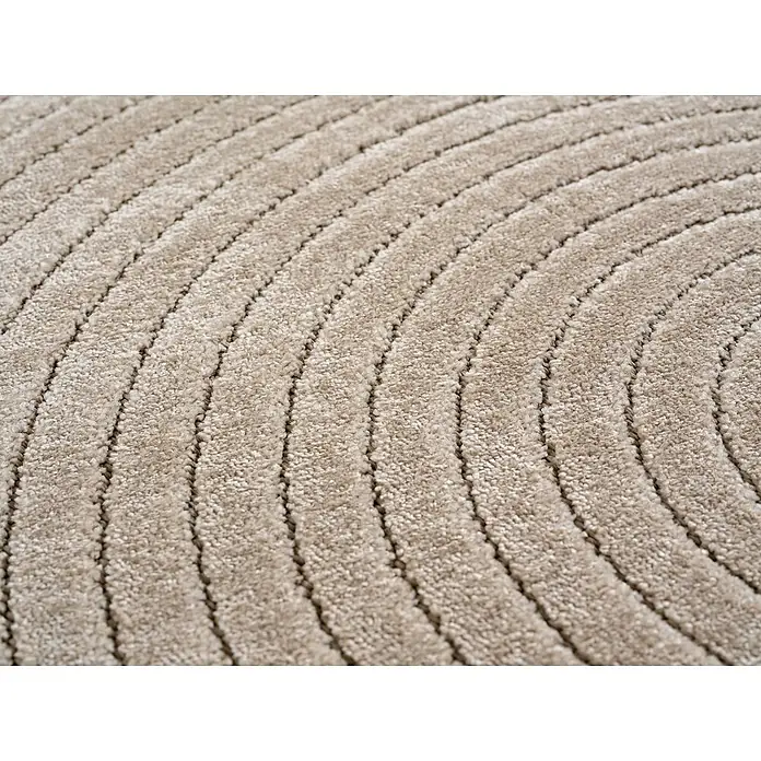 Outdoor-Teppich Nova I - Beige, Durchmesser: 80 cm, 100 % Polypropylen - Nahaufnahme eines beigen Teppichs mit einem sich wiederholenden, konzentrischen Kreismuster, das eine weiche, strukturierte Oberfläche zeigt.