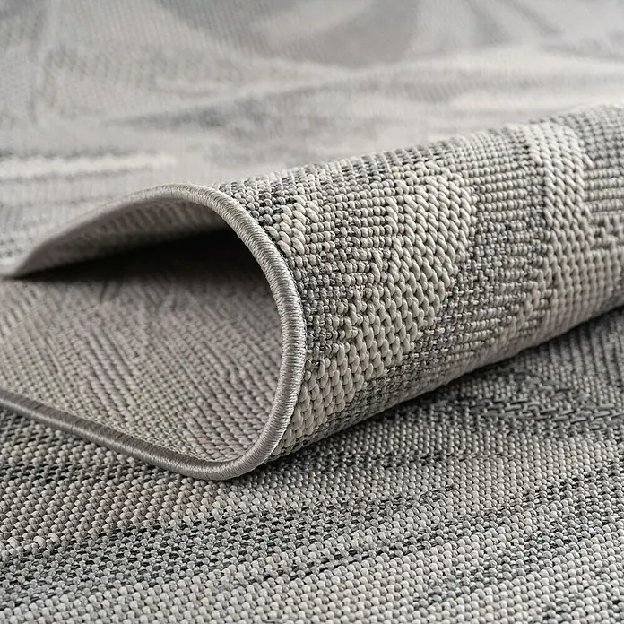 Outdoor-Teppich Desert 1303 - Grau, 200 x 140 cm, 100 % Polypropylen - Nahaufnahme eines stilvollen, gewebten Teppichs in Grau, der Textur und Qualität betont.