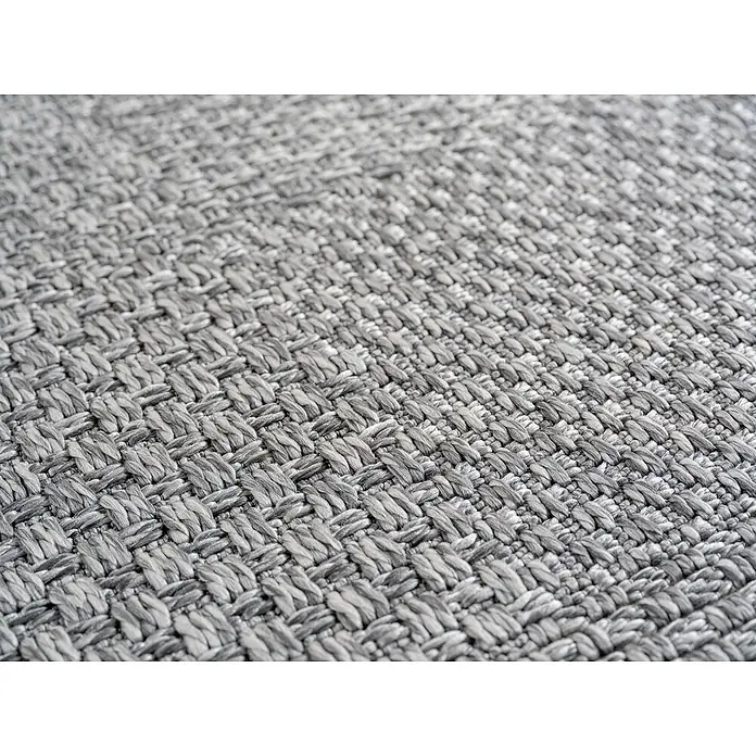 Outdoor-Teppich Ibiza I - Grau, 170 x 120 cm, 100 % Polypropylen - Detailaufnahme eines gewebten, grauen Teppichs mit einer markanten Textur, die die hochwertige Verarbeitung des Teppichs hervorhebt.