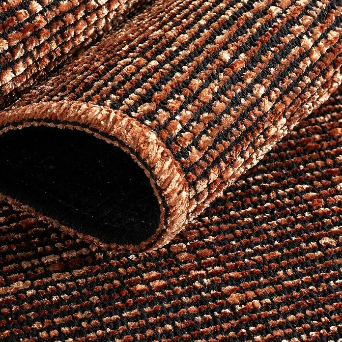 Flachgewebeteppich Space - Kupfer, 290 x 200 cm, 84 % Baumwolle, 16 % Polyester - Detailaufnahme eines gewebten Teppichs mit braunen und schwarzen Farbtönen, der eine interessante Textur zeigt.