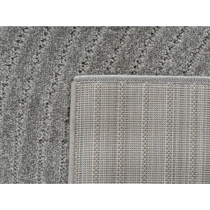 Outdoor-Teppich Nova I - Silver, Durchmesser: 80 cm, 100 % Polypropylen - Detailansicht eines grauen Teppichs mit einem dezenten Muster und einer robusten Unterseite, ideal für jeden Raum.