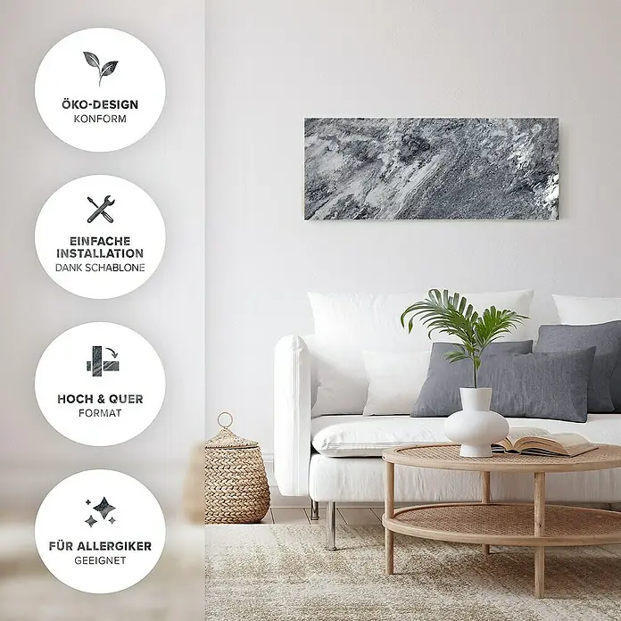 Marwona Infrarotheizkörper Infrarotheizung - 800 W, Shadow Grey 800 Watt Smart Home - Ein stilvolles Wohnzimmer mit einem modernen Wandbild in Marmoroptik über einem weißen Sofa und einem runden Tisch.