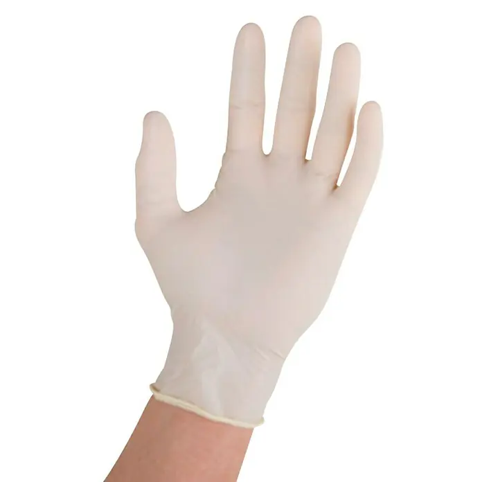 Vileda Guantes desechables Multi látex - 10 ud. - Protección higiénica: Primer plano de una mano que lleva un guante desechable, ideal para fines médicos o de limpieza.
